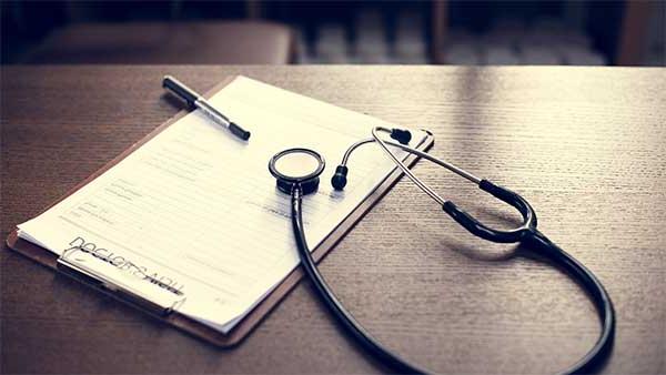 clipboard, stethoscope, and writing pen